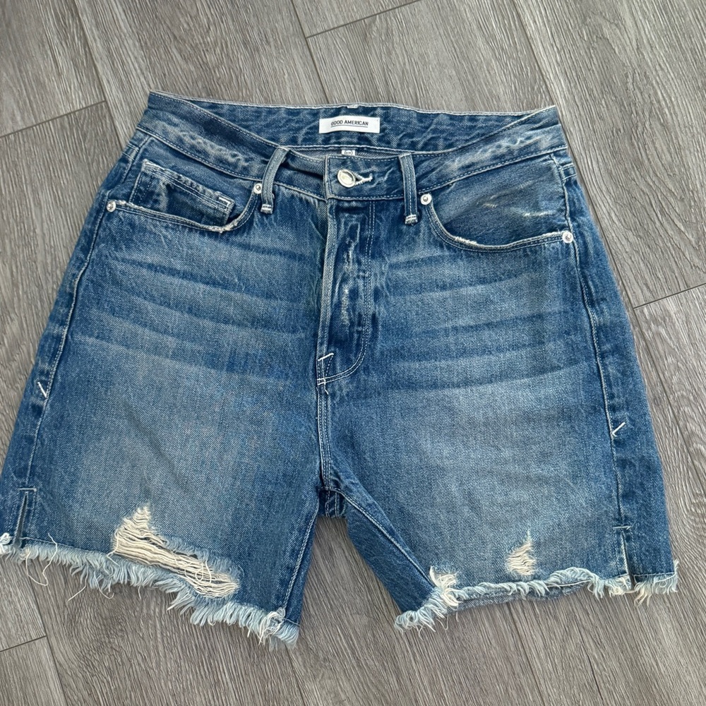 Good American size 25 / size 0 long denim jeans shorts with raw hem & rips